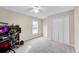Neutral carpeted bedroom with a ceiling fan, closet, and a window for lots of natural light at 1712 Bonnabel Ne Trce, Marietta, GA 30066