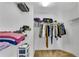 Walk-in closet with ample shelving and hanging space for organized storage at 1712 Bonnabel Ne Trce, Marietta, GA 30066