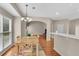 Open dining room with wood floors, a chandelier, and table, next to living areas at 1712 Bonnabel Ne Trce, Marietta, GA 30066