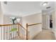 Bright hallway featuring neutral decor, and an elegant chandelier over the stairwell at 1712 Bonnabel Ne Trce, Marietta, GA 30066