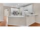 Well-lit kitchen with white cabinets and stainless steel appliances at 1712 Bonnabel Ne Trce, Marietta, GA 30066