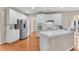 Bright kitchen with white cabinets, stainless steel appliances, and hardwood floors at 1712 Bonnabel Ne Trce, Marietta, GA 30066