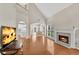 Great room featuring fireplace, hardwood floors, high ceiling and view of upstairs and dining area at 1712 Bonnabel Ne Trce, Marietta, GA 30066