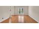 Bright living room featuring hardwood floors and a large window at 1712 Bonnabel Ne Trce, Marietta, GA 30066
