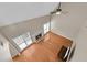 Open living room with hardwood floors, a fireplace, and large windows for ample natural light at 1712 Bonnabel Ne Trce, Marietta, GA 30066