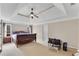 Spacious main bedroom with tray ceiling, fan, and a king bed at 1712 Bonnabel Ne Trce, Marietta, GA 30066