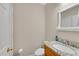 Modern powder room with granite countertop, vanity, sink, and mirror at 1712 Bonnabel Ne Trce, Marietta, GA 30066