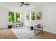 Inviting bedroom with natural light, modern decor, and a ceiling fan at 2926 5Th Sw St, Atlanta, GA 30315