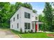 Striking modern home with a bold red door, lush lawn, and ample natural light at 2926 5Th Sw St, Atlanta, GA 30315
