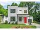 Modern white two-story home featuring a bright red front door and lush green lawn at 2926 5Th Sw St, Atlanta, GA 30315