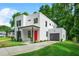 Contemporary home boasts a two-car garage, green lawn, and modern design at 2926 5Th Sw St, Atlanta, GA 30315
