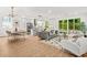 Open-concept living room, dining, and kitchen area with modern decor and ample natural light at 2926 5Th Sw St, Atlanta, GA 30315