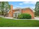 Large brick house with a chimney, a well-manicured lawn, and a patio at 110 Glen Eagle Way, Mcdonough, GA 30253