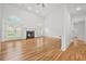 Bright living room with fireplace, hardwood floors, and double doors at 110 Glen Eagle Way, Mcdonough, GA 30253