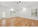 Spacious primary bedroom featuring wood floors, recessed lighting, and natural light at 110 Glen Eagle Way, Mcdonough, GA 30253