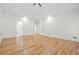 Spacious bedroom with hardwood floors, tray ceiling, and ensuite bathroom entrance at 110 Glen Eagle Way, Mcdonough, GA 30253