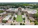 An aerial view of a vibrant community showcasing its central green spaces, well-designed buildings, and streetscape at 2100 Willshire Gln, Alpharetta, GA 30009