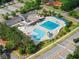 Aerial view of neighborhood pool with plenty of seating, kid area, and parking at 2100 Willshire Gln, Alpharetta, GA 30009