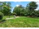 Scenic green space with a winding path amidst lush trees, offering a serene escape for residents at 2100 Willshire Gln, Alpharetta, GA 30009