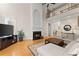 Bright living room features a fireplace, a large sectional sofa and access to an outdoor balcony at 2100 Willshire Gln, Alpharetta, GA 30009
