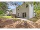 Backyard showcasing the home's siding, a sliding door, and a concrete patio at 3425 Sable Chase Ln, South Fulton, GA 30349