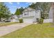 Charming two-story home featuring gray siding, attached garage and a well-maintained lawn at 3425 Sable Chase Ln, South Fulton, GA 30349