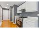 Modern kitchen featuring white cabinets, stainless steel appliances and hardwood floors at 3425 Sable Chase Ln, South Fulton, GA 30349