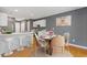 Cozy dining area and kitchen with white cabinets, stainless steel appliances and hardwood floors at 3425 Sable Chase Ln, South Fulton, GA 30349