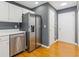 Updated kitchen features stainless steel appliances, hardwood floors, and white cabinetry at 3425 Sable Chase Ln, South Fulton, GA 30349