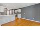 Clean eat-in kitchen with white cabinets, stainless steel appliances and hardwood floors at 3425 Sable Chase Ln, South Fulton, GA 30349