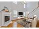 Bright living room featuring hardwood floors, a fireplace, and a staircase to the second floor at 3425 Sable Chase Ln, South Fulton, GA 30349