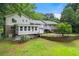 Expansive backyard featuring a patio, sunroom and lush greenery, offering a private outdoor oasis at 486 Buttercup Trl, Lawrenceville, GA 30046
