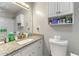 Bright bathroom features granite countertops, a white vanity, and decorative wall accents at 486 Buttercup Trl, Lawrenceville, GA 30046
