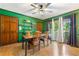 Charming dining room with hardwood floors, decorative shelves, and natural light from the window at 486 Buttercup Trl, Lawrenceville, GA 30046