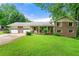 Charming two-story home with brick and siding exterior and a well-manicured lawn, plus a two-car garage at 486 Buttercup Trl, Lawrenceville, GA 30046