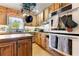 View of the kitchen featuring butcher block counters, wood cabinets, and stainless steel double oven at 486 Buttercup Trl, Lawrenceville, GA 30046
