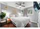 Bright main bedroom with hardwood floors, ceiling fan, and a cozy atmosphere at 486 Buttercup Trl, Lawrenceville, GA 30046