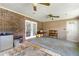 Enclosed sunroom features brick wall, bright white french doors, and neutral color palette at 486 Buttercup Trl, Lawrenceville, GA 30046