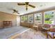 Bright sunroom featuring lots of natural lighting from the many windows at 486 Buttercup Trl, Lawrenceville, GA 30046