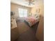 Neutral bedroom with a queen-sized bed, dresser, and a bright sunny window at 7625 Cedar Grove Ct, Fairburn, GA 30213