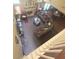 Overhead view of the living room with a fireplace, L-shaped couch, and neutral-toned carpet at 7625 Cedar Grove Ct, Fairburn, GA 30213