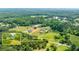 Aerial view illustrating the property's location with tree coverage and road access at 1730 Lee Peters Rd, Loganville, GA 30052