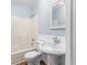 Bathroom featuring a shower and pedestal sink at 1730 Lee Peters Rd, Loganville, GA 30052
