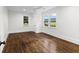 Spacious bedroom with ceiling fan and hardwood flooring at 1730 Lee Peters Rd, Loganville, GA 30052