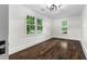 Bedroom featuring hardwood floors and natural light at 1730 Lee Peters Rd, Loganville, GA 30052