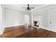Living room features hardwood floors, a fireplace, and neutral wall paint at 1730 Lee Peters Rd, Loganville, GA 30052