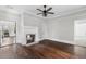 Spacious living room with hardwood floors, fireplace, and neutral paint, providing a cozy atmosphere at 1730 Lee Peters Rd, Loganville, GA 30052