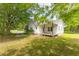Exterior showcasing a classic covered porch, a well-maintained lawn and driveway at 1730 Lee Peters Rd, Loganville, GA 30052