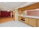 Bright kitchen featuring custom wood cabinets, stainless steel appliances, and tile floors at 1926 Parkwood Rd, Snellville, GA 30078