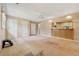 Cozy living room featuring a bar overlooking the kitchen and multiple entryways to other rooms at 1926 Parkwood Rd, Snellville, GA 30078